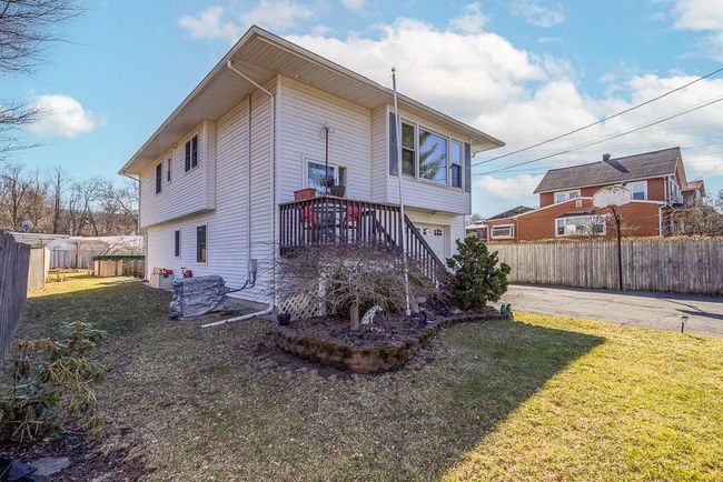 Back of house with driveway, yard, and fence | Image 18