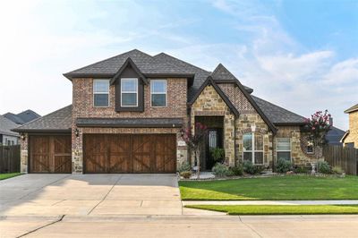 View of front of home with a garage and a front lawn | Image 2