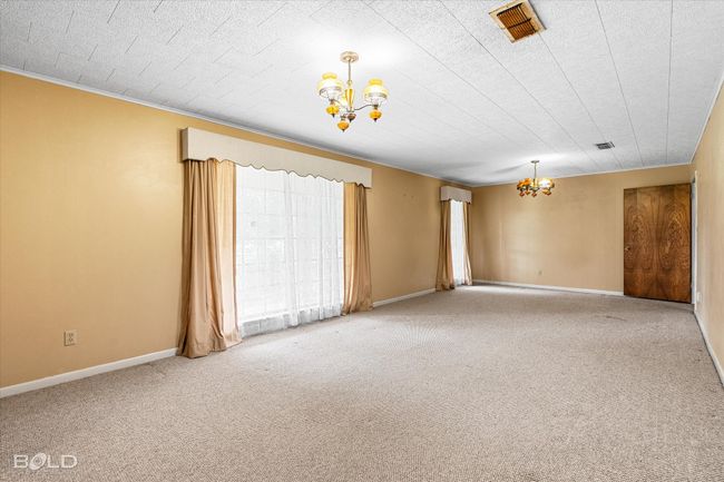 Featuring a chandelier, carpet, and baseboards | Image 7