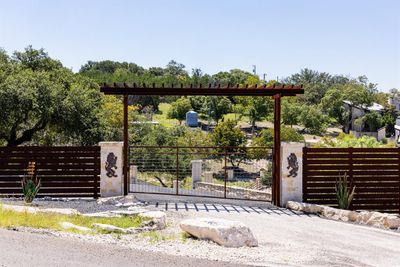 Custom-made ironand stone entry with a latch gate and iron transom. | Image 3