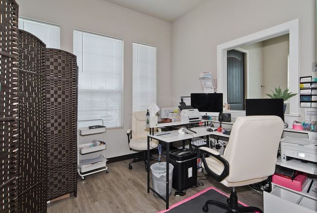 Office area with wood finished floors | Image 7