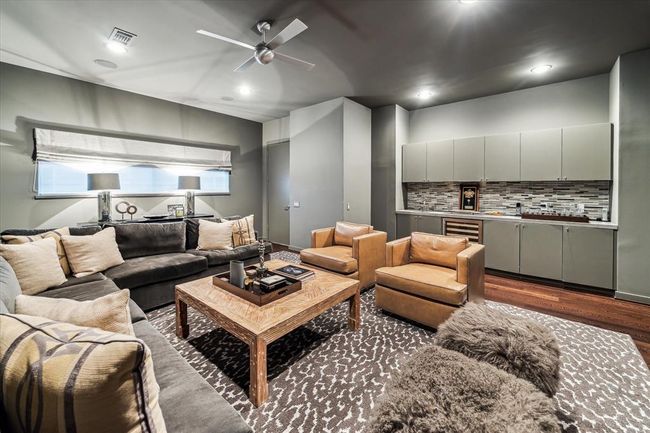 Closer view of the GAME ROOM with its sizable Wet Bar positioned against the side wall. | Image 36