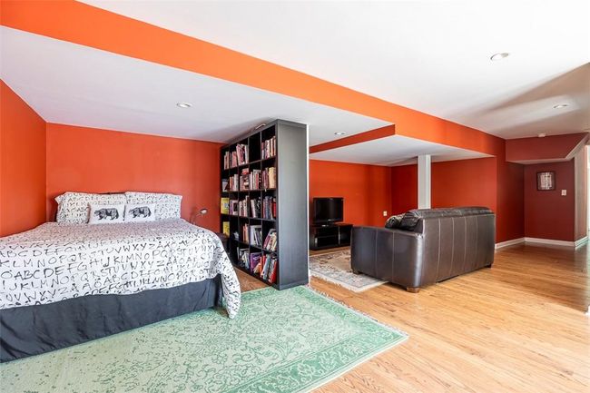 Bedroom on lower level, with full bath and sliders to patio | Image 24