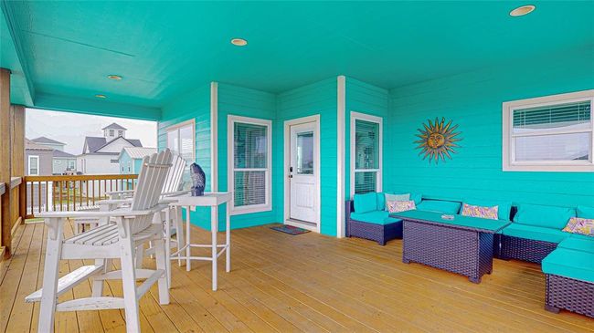 This spacious balcony offers a peekaboo view of the beach. With plenty of room for outdoor entertaining, it’s the perfect spot to relax, enjoy the coastal breeze, and take in the natural beauty around you. | Image 8