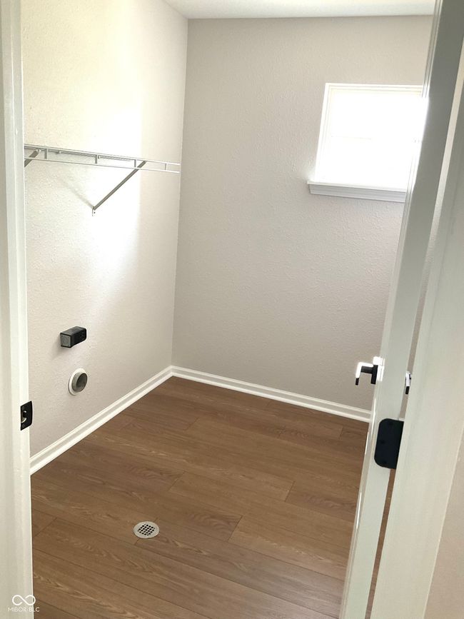 Full laundry room on second level with new flooring and paint. | Image 26