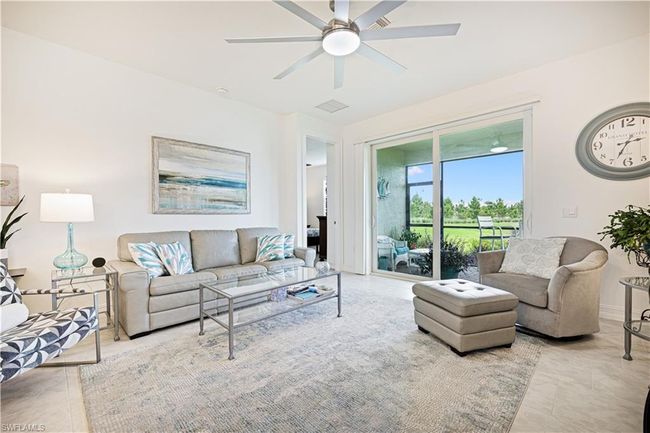 Tiled living room featuring ceiling fan | Image 10