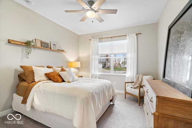 carpeted bedroom with baseboards and a ceiling fan | Image 5
