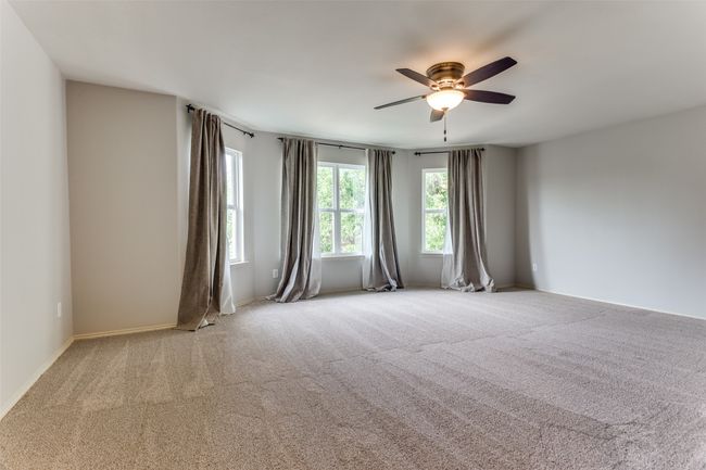 Unfurnished room featuring a ceiling fan and carpet flooring | Image 37