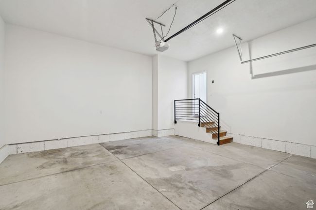 Garage with a garage door opener | Image 34