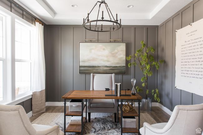 Office area featuring a raised ceiling, hardwood / wood-style floors, and a notable chandelier | Image 4