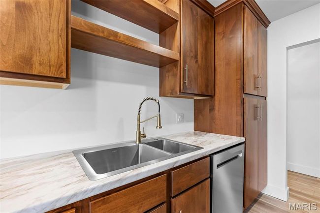 Kitchen with dishwasher, light hardwood/wood-style floors, and sink | Image 9
