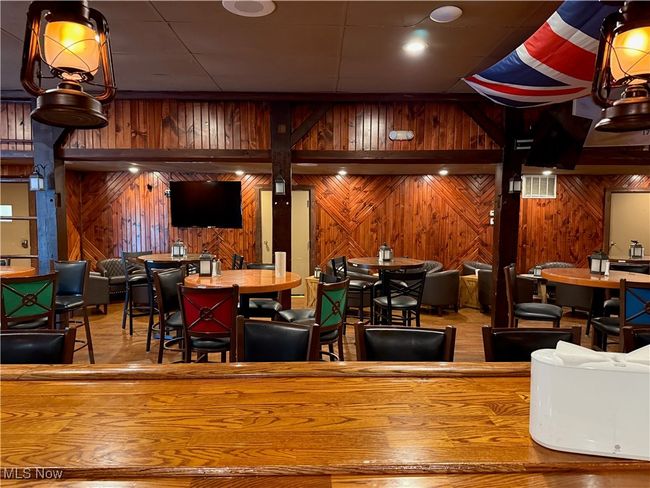 Dining area with wood walls | Image 21