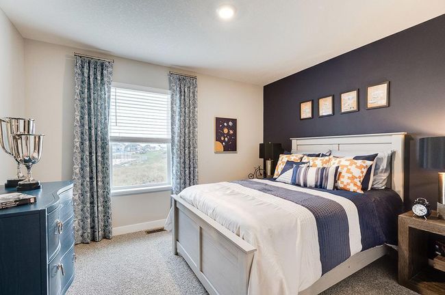 In addition to the primary bedroom, the home's upper level also includes these two additional bedrooms, and another full bathroom just adjacent to each! Photo of model, colors and options will vary. | Image 16