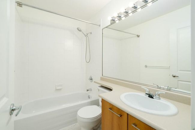 Bathroom with shower combination, toilet, and vanity | Image 32