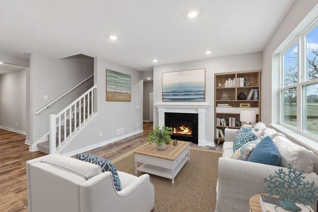 Spacious living room with electric fireplace (not shown). Model photo. Options and colors will vary. | Image 11
