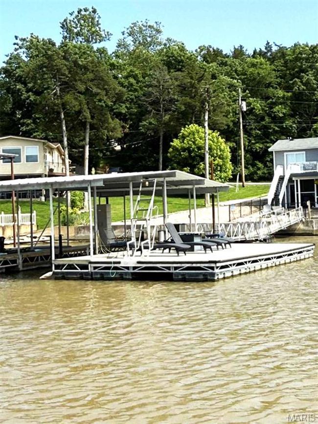 Dock area featuring a water view | Image 10