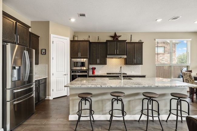 Kitchen featuring large center island | Image 16