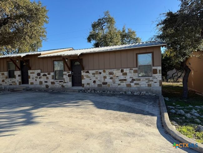 Each apartment has own entrance and back patio. Another view of apartment community. | Image 17