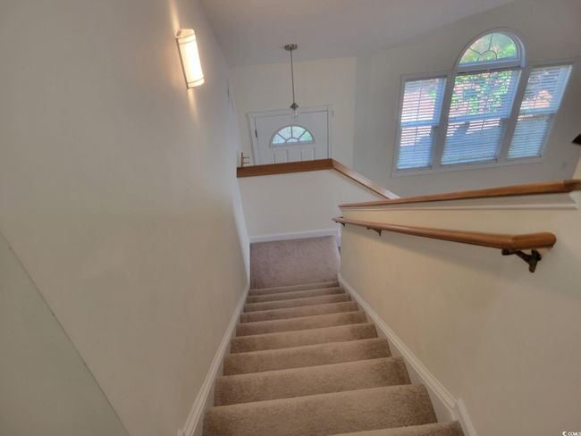 Stairway featuring healthy amount of natural light and carpet floors | Image 8