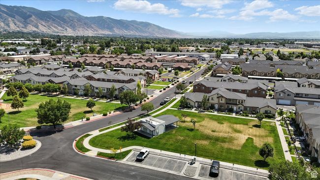 Aerial overview of property's location with a mountainous background and nearby suburban area | Image 38