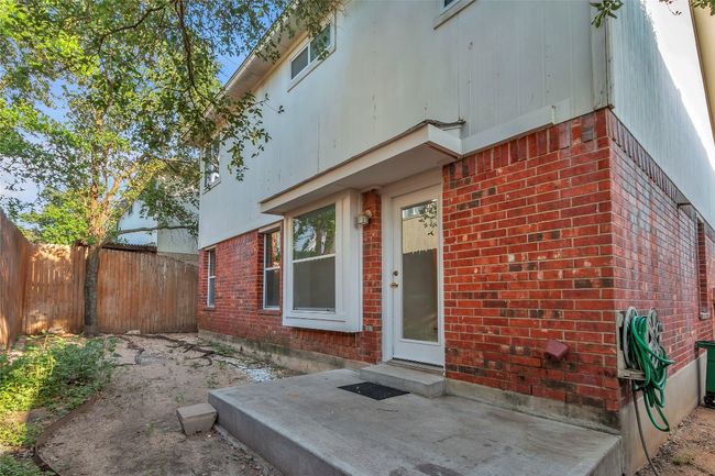 Property entrance with brick siding and a patio | Image 29