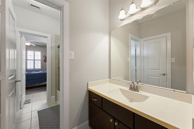 Second vanity area of the Jack-and-Jill bathroom, offering ample counter space, updated fixtures, and privacy for each connected bedroom. Designed for convenience and functionality, ideal for shared use. | Image 22