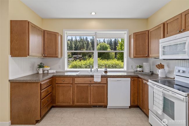 Large windows, cozy charm, and practical design. | Image 11