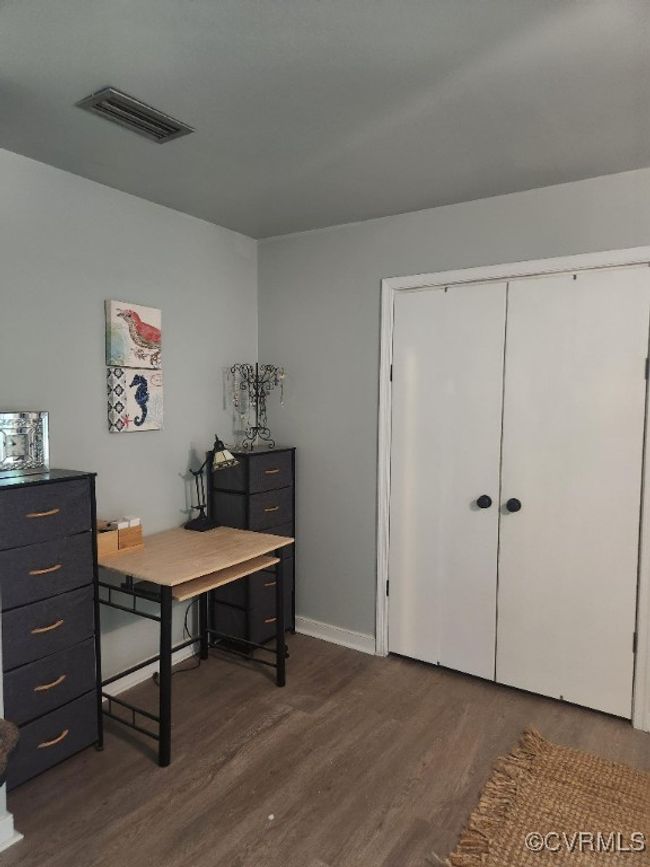 Office with dark wood finished floors and baseboards | Image 18