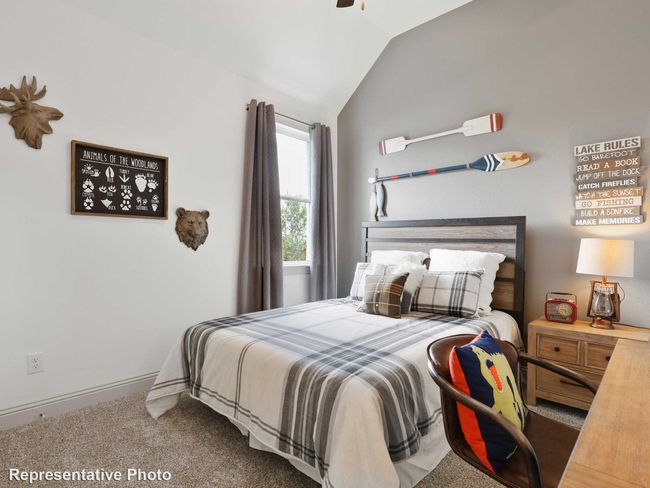 Bedroom with lofted ceiling, carpet floors, and baseboards | Image 13