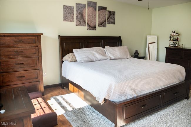 Bedroom featuring light wood finished floors and baseboards | Image 32
