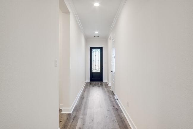 Entryway featuring crown molding, wood finished floors, and recessed lighting | Image 6
