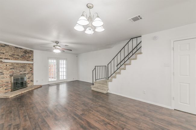 Living room with french doors leading to encloed patio. | Image 4