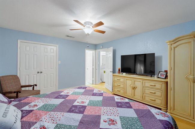 Primary bedroom with double doors leading to walk in closet and door leading to private bath. | Image 21