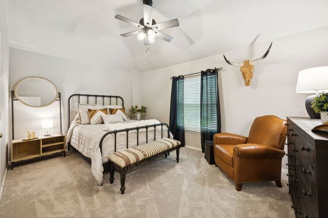 Carpeted bedroom with lofted ceiling, walk-in closet and ceiling fan | Image 25