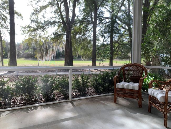 screened porch overlooking golf course | Image 27