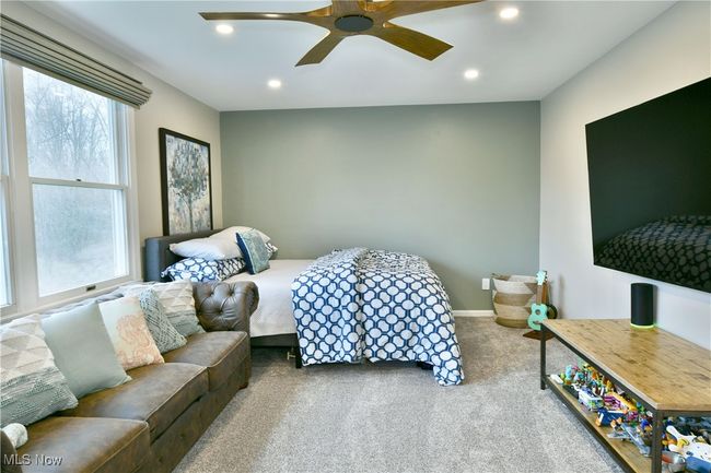Carpeted bedroom with ceiling fan, recessed lighting, and baseboards | Image 35