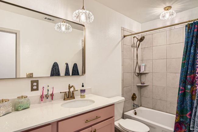 Full bathroom with vanity and shower / bath combination with curtain | Image 23