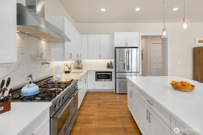 Stainless steel appliances, including 6-burner Bertazzoni range and double oven. | Image 10