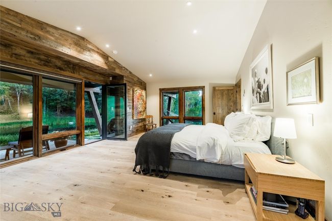 Primary suite with private patio overlooking the pond. | Image 30