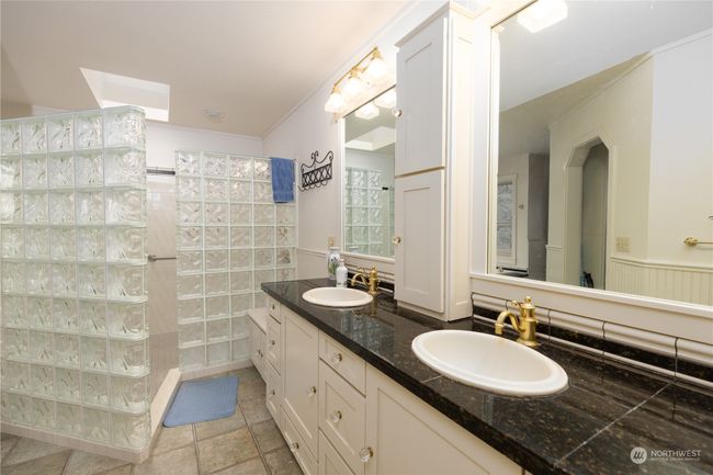Walk in glass block shower and double vanity in Primary bath | Image 31