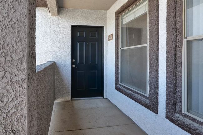 Property entrance with stucco siding | Image 7