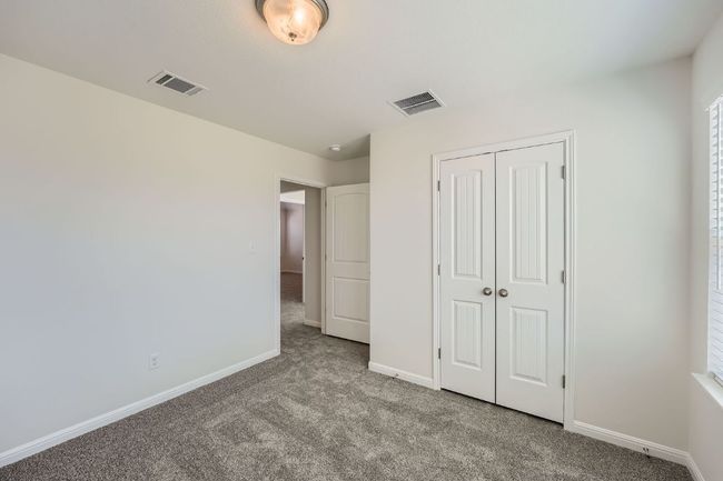 Unfurnished bedroom featuring a closet, visible vents, carpet flooring, and baseboards | Image 20