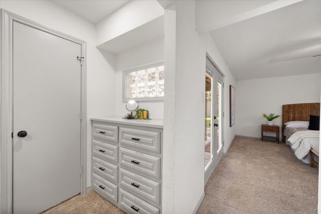 Primary bedroom includes door to patio and convenient built in drawers! | Image 23