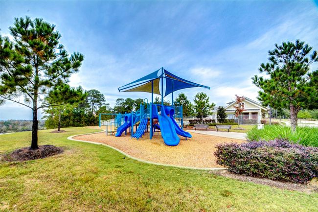 The kiddos will love to come and play at the playground next to the community pool. | Image 32