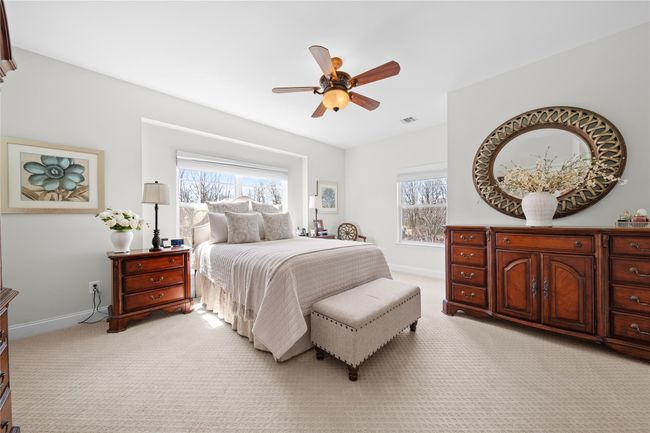 Bedroom with light carpet, multiple windows, and baseboards | Image 19