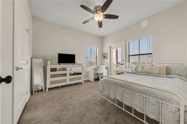 Bedroom featuring carpet flooring and ceiling fan | Image 29