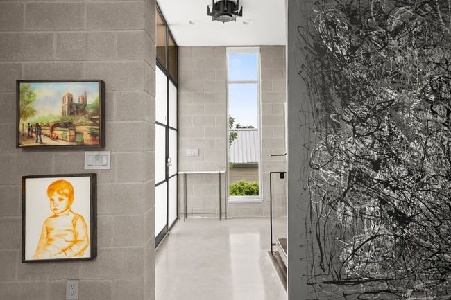 View from the front bedroom/office- custom art, windows, glass and light. | Image 6