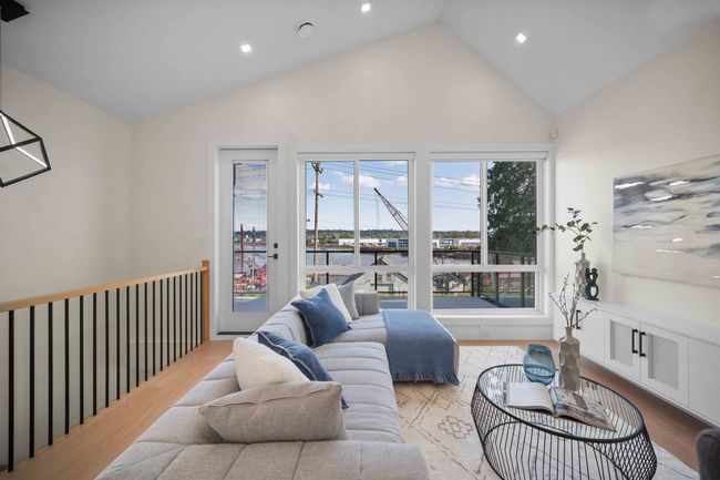 Living area featuring high vaulted ceiling, recessed lighting, and wood finished floors | Image 10
