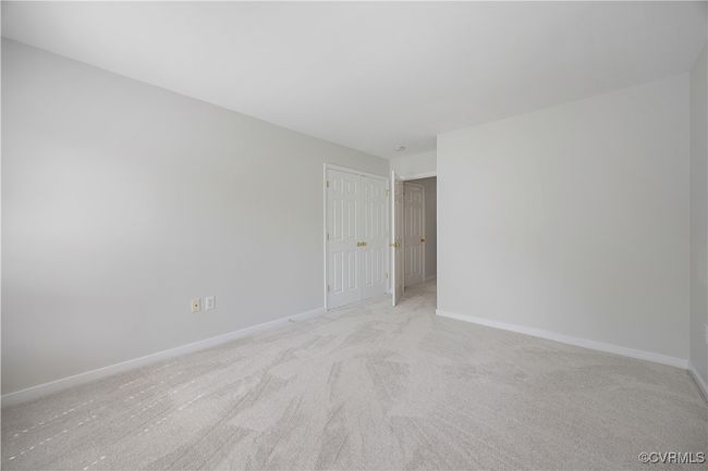 Empty room featuring baseboards and light colored carpet | Image 32