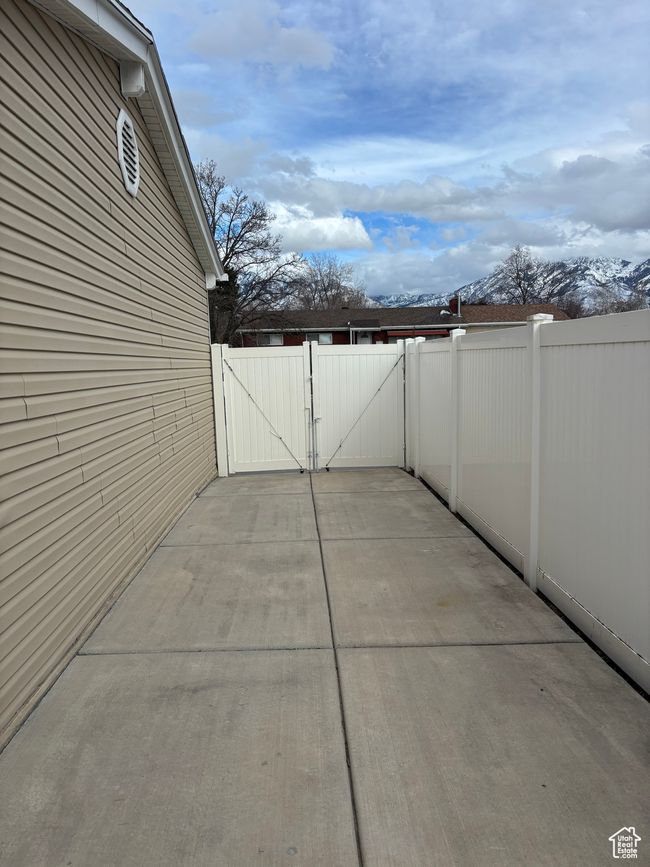 View of patio with a gate and fence | Image 20